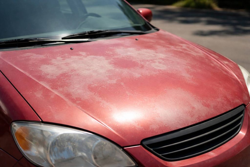 Car painting example showing faded paint and dull finish.